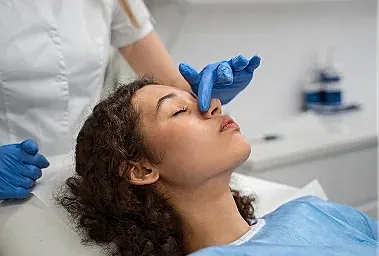 Facial treatment in a clinical setting.