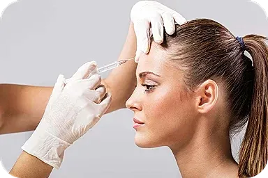Woman receiving cosmetic injectables treatment.