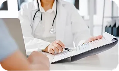 Doctor reviewing patient documents in an office.