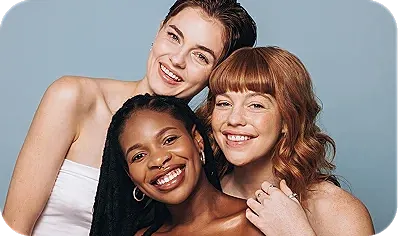 Three smiling women with diverse hairstyles.