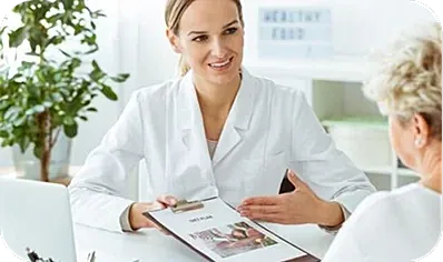 Nutritionist consulting with a client in office.