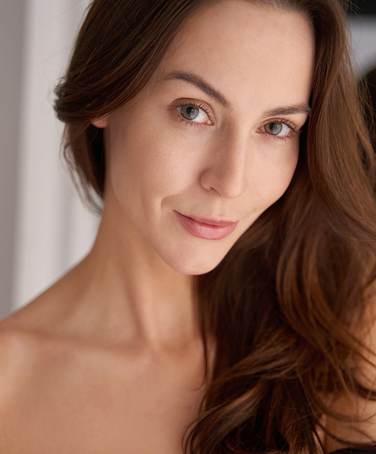 Close-up portrait of a woman with brown hair.