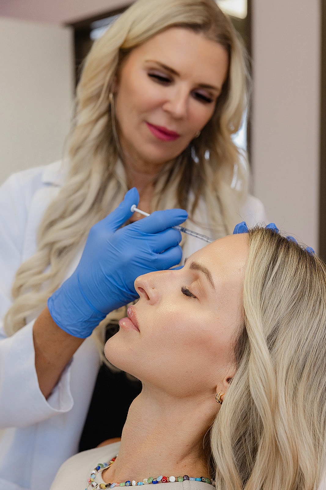 Cosmetic treatment in progress at a clinic.